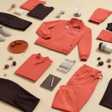 flat lay displaying orange and brown scrubs and medical accessories