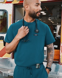 Man in Caribbean Blue scrubs with stethoscope