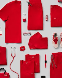 Flat lay showing red scrubs and accessories