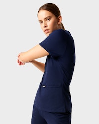 Woman stretching in scrubs