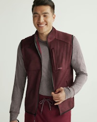 man wearing underscrubs and vest
