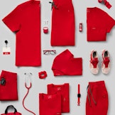 flat lay of red colored scrubs and accessories