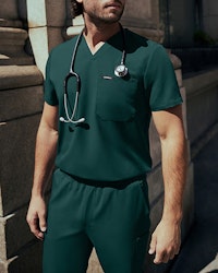 Man wearing midnight green scrubs.