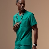 man wearing hunter green scrub set