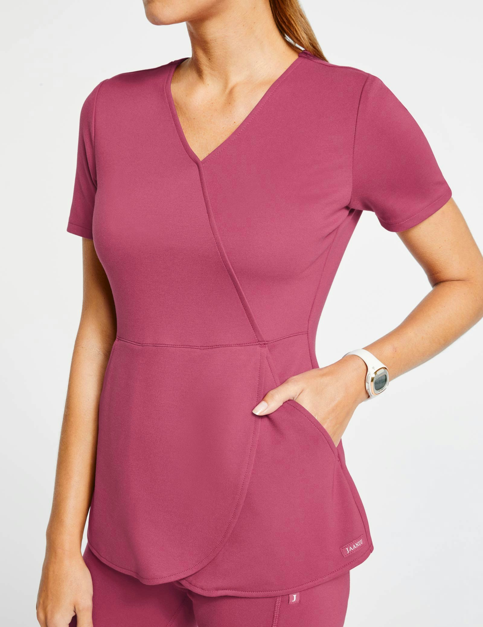 Women's MockWrap Tulip Top in Warm Berry Medical Scrubs by Jaanuu