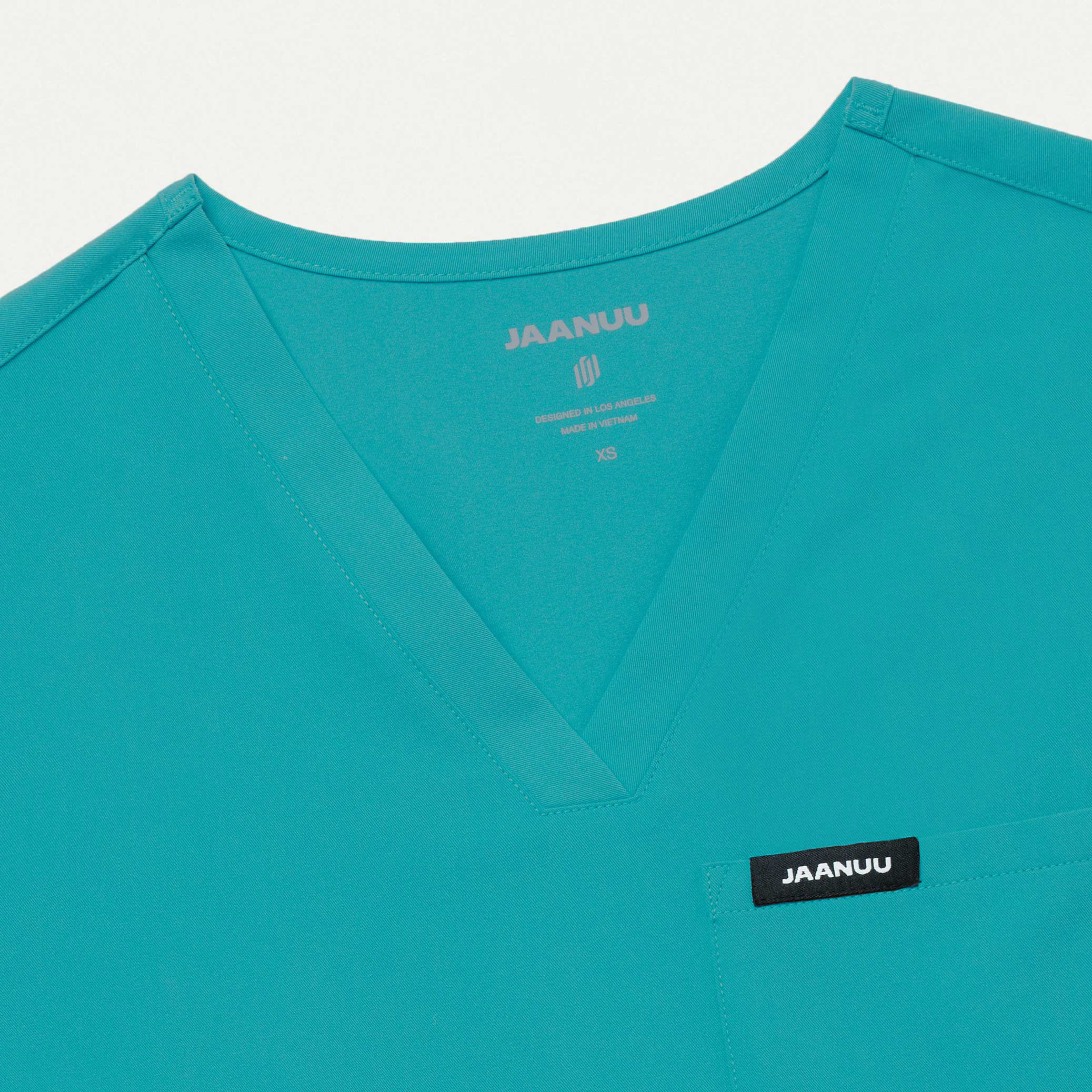 Rhena Essential 1Pocket Scrub Top in Aqua Women's Tops by Jaanuu